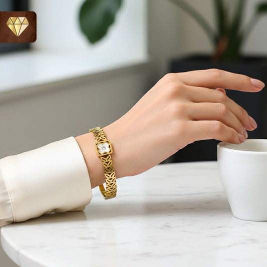 Gold-plated Kada bracelet with cut-out leaf motifs and mother-of-pearl clover centerpiece with cubic zirconia – Monica’s Jewel Studio