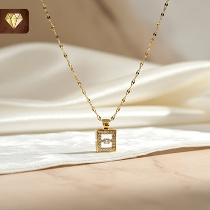 Gold-plated perfume bottle pendant necklace with solitaire and AD (American Diamond) CZ stones for women