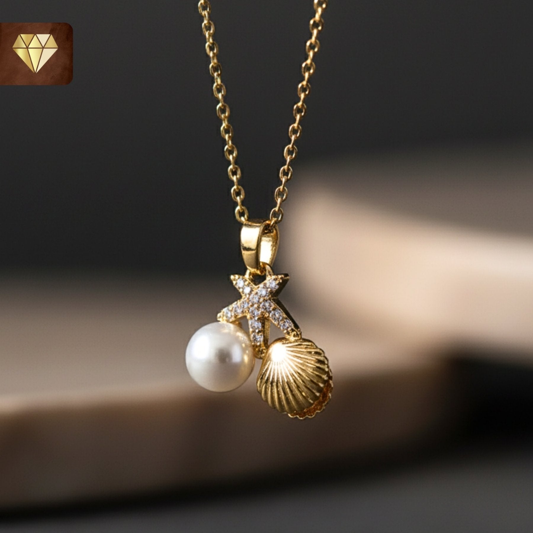 Gold-plated ocean charm pendant necklace with starfish, shell and pearl CZ stones for women