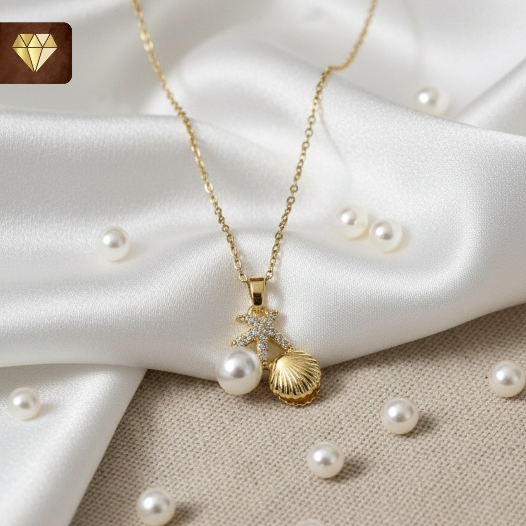 Gold-plated ocean charm pendant necklace with starfish, shell and pearl CZ stones for women