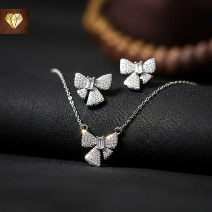Silver-plated bow pendant necklace with matching earrings set studded with AD (American Diamond) CZ stones for women