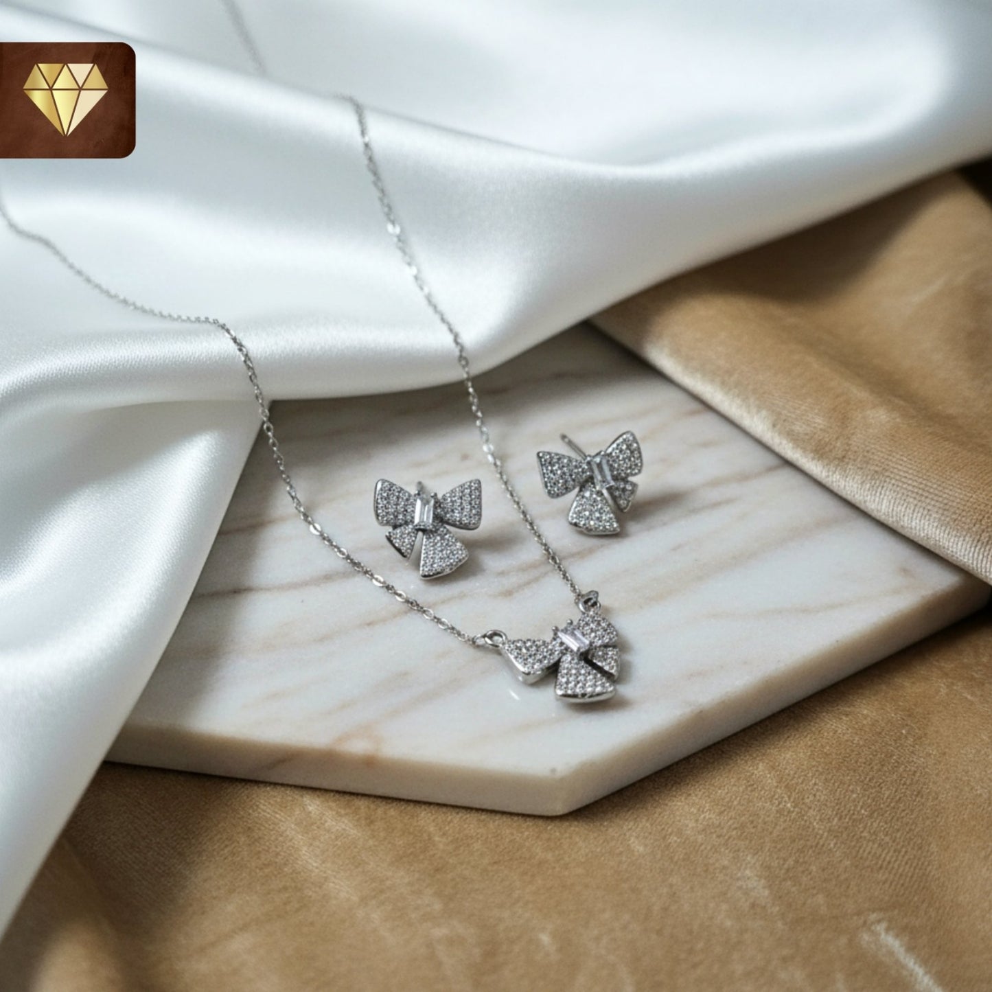 Silver-plated bow pendant necklace with matching earrings set studded with AD (American Diamond) CZ stones for women